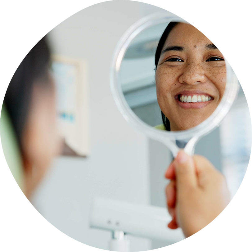patient smiling at Dr. Sumeet Kaur Family Dentistry in Rocklin, CA