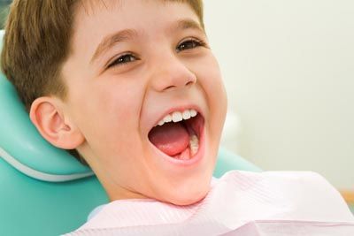 young boy getting his teeth cleaned