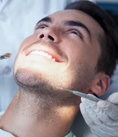 man getting dental care at Dr. Sumeet Kaur Family Dentistry
