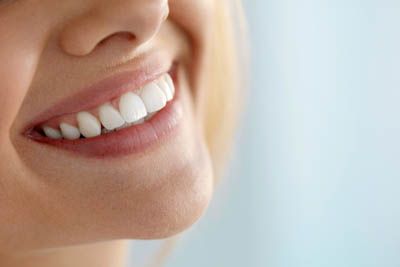patient loving her smile after periodontal treatment